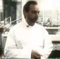 Jimbo posing in lab coat.jpg